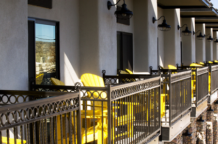 Yellow chairs on balconies in morning light, Old town Cottonwood Arizona.の写真素材