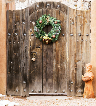 Holiday Wreath on a Wooden Entryway in Santa Fe, New Mexicoの写真素材