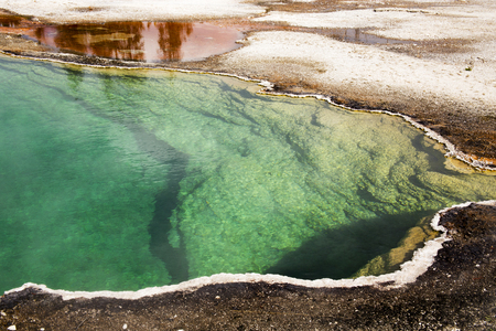 West Thumb Geyser Basin Copper, green and Yellow, Yellostone National Park, Wyomingの写真素材