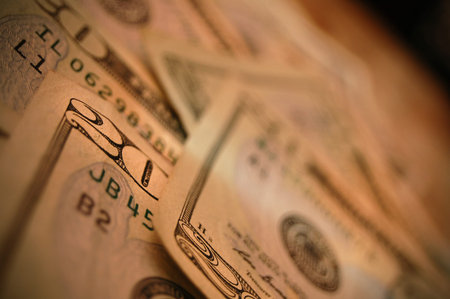 Twenty dollar bills scattered across a table.