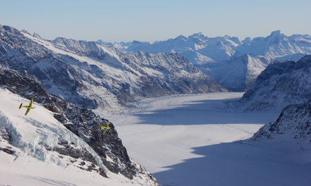 View of the glacier at Jungfrau with aeroplanes flying throughの写真素材