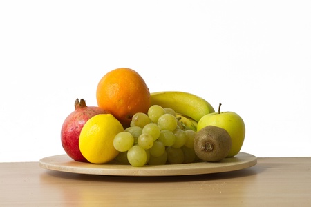 Fruits on wooden plateの写真素材