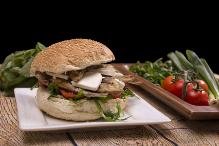 Burger with fried sardinas and feta cheeseの写真素材