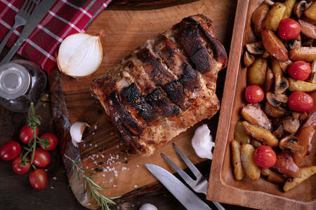 Roasted pork with onion and tomatoesの写真素材
