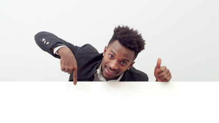 businessman showing white page holding blank boardの写真素材