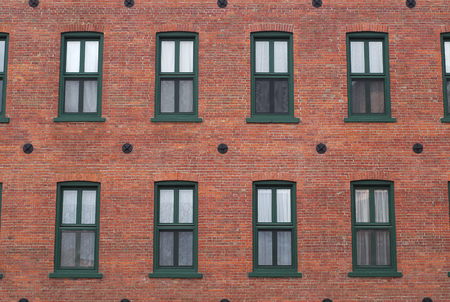 residential building facade red brick windows aged home architecture の写真素材