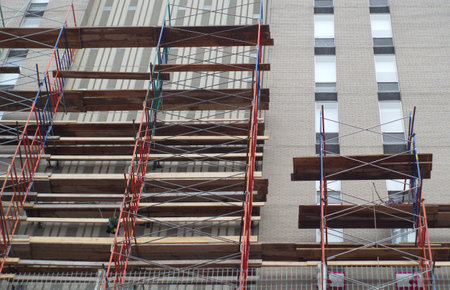 skyscraper scaffold building construction site renovation high facade windows