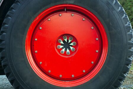 red tractor wheel large machinery metal rim rubber circleの写真素材