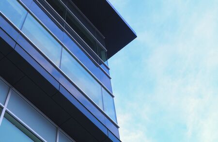blue building corner glass skyscraper office towerの写真素材