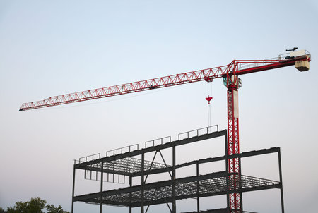 crane on construction site metal structure tower