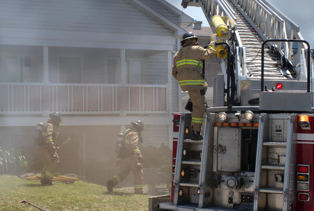 house under fire and smoke firefighter emergency team