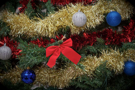 christmas tree decorations holiday celebrations blue balls and red ribbon backgroundの写真素材