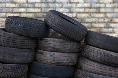 pile of used tires rubber recycling automobile waste junk pollution