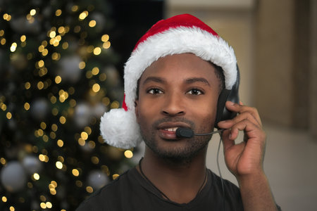 christmas support center customer service helpline red santa claus hat office receptionist headsetの写真素材