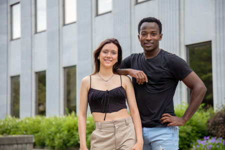 man and woman street style couple cool relationship students friends together on the school campusの写真素材