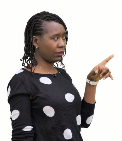 African woman with braided hair and polka dot sweater dots with a doubtful unsure expression isolated on white background. Perfect for concepts of questioning, uncertainty, decision making, and doubt.の写真素材