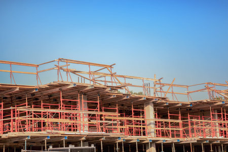 Modern steel construction building showing structural framework and metal beams development....