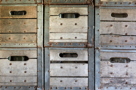 Stacked vintage wooden crates create rustic farm market background. Perfect for farmhouse decor, produce stands, agricultural themes and rustic interior or retail design projects.の写真素材
