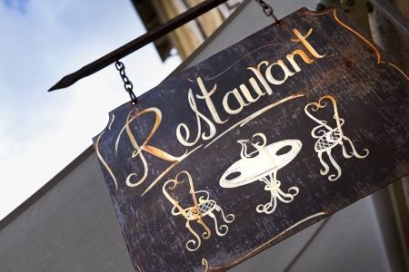Old restaurant sign in a French villageの写真素材