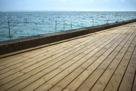 Wooden deck by the seaの写真素材