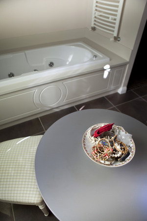 Jewelry on a table in a bathroomの写真素材