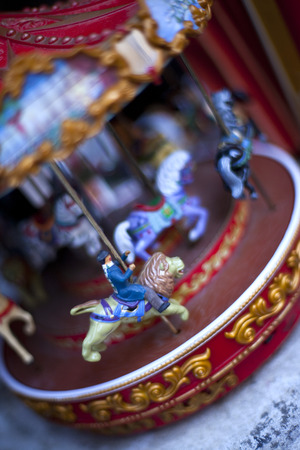 Miniature carousel in a flea marketの写真素材