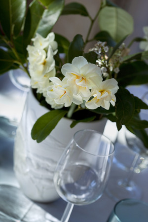 Bunch of flowers on a table in a restaurantの写真素材