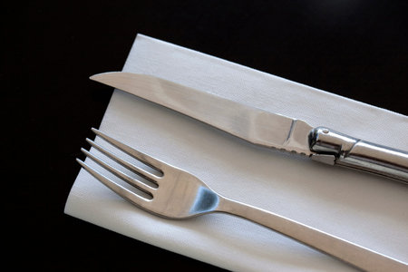 Fork and knife on a napkin