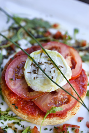 Puff pie with tomato and goat cheeseの写真素材