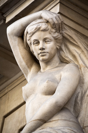 Stone statue on a French buildingの写真素材