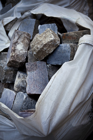 Bag on cobblestones on a construction siteの写真素材