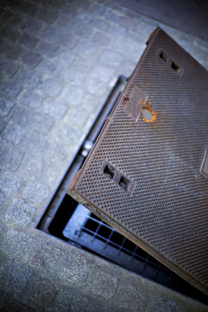 Open sewer in a streetの写真素材