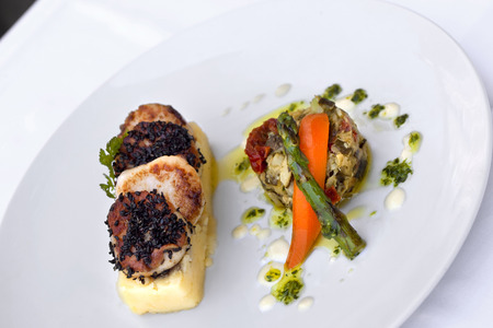 St. Jacques and vegetable on a plateの写真素材