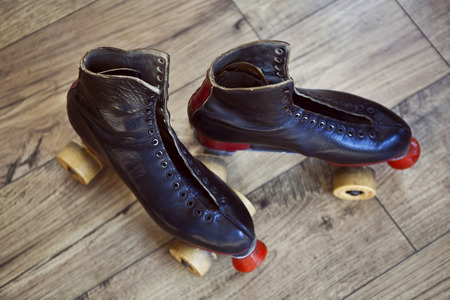 Vintage rollers on a wooden floorの写真素材