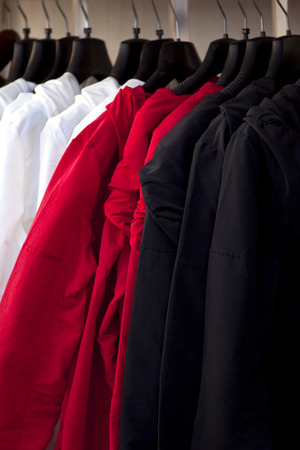 Coats hanging in a storeの写真素材