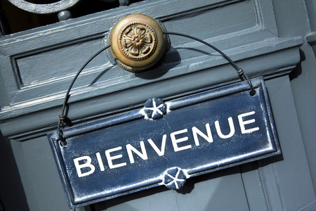 Welcome sign on the door of a French innの写真素材