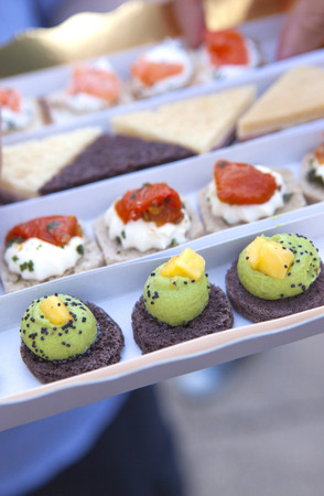 Serving various toast on a plate at a partyの写真素材