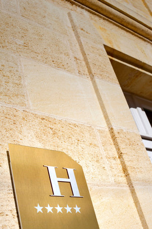 Five stars hotel sign on a stoned wallの写真素材