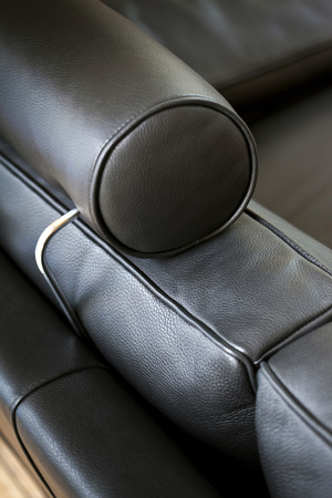 Focus on a stylish black leather sofaの写真素材