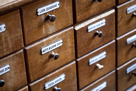 Drawers of a wooden furniture in an old herbalist shopの写真素材