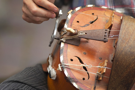 Playing old viola in a Britain bandの写真素材