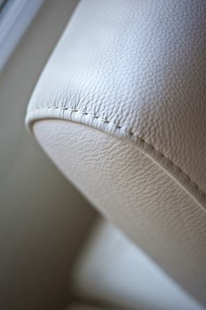 Focus on sewing of a leather sofaの写真素材