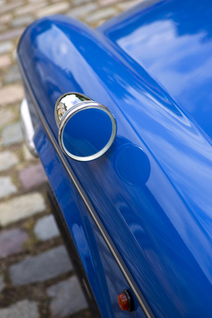Mirror on the body of an old carの写真素材