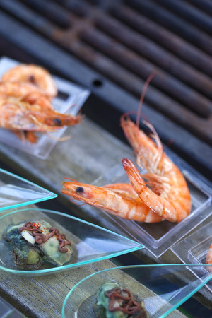 Shrimp, oysters and vinegar cream on a buffetの写真素材