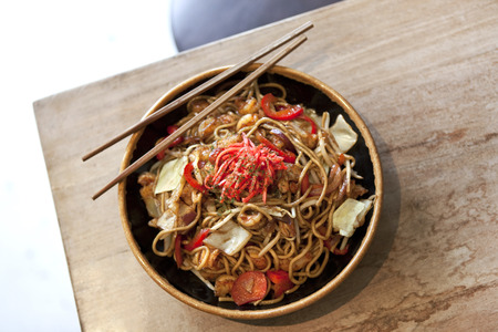 Asian noodles with tofu, shrimp and peppersの写真素材