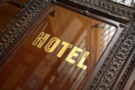 Old door of a French hotel in Parisの写真素材