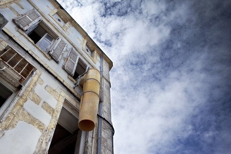 Facade of an old house on a renovation siteの写真素材