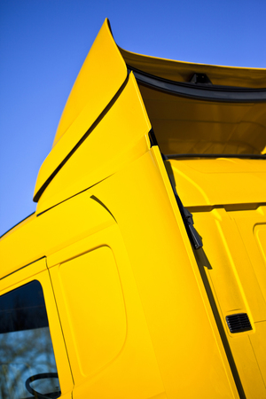 Close up of car body of a yellow truckの写真素材