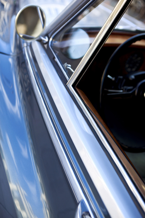 Mirror and window of a car parked in the cityの写真素材