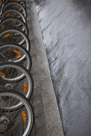 Bike parking in the city after rainingの写真素材